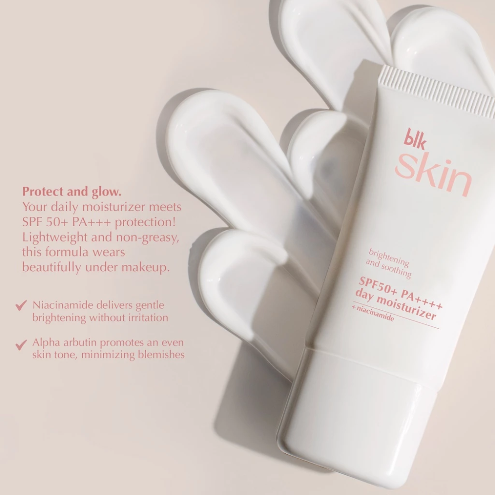 White skincare product with 'blk skin' branding on a beige background Blk Skin Brightening & Soothing SPF50+ PA+++ Day Moisturizer + Niacinamide Blk Cosmetics
