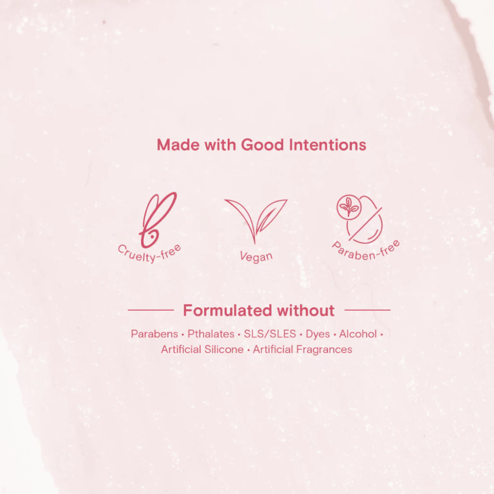 Product packaging with cruelty-free, vegan, and paraben-free icons on a light pink background.