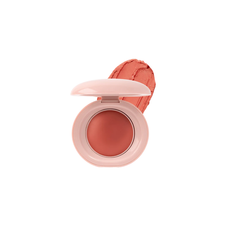 Compact blush with open lid showing blush color on a white background