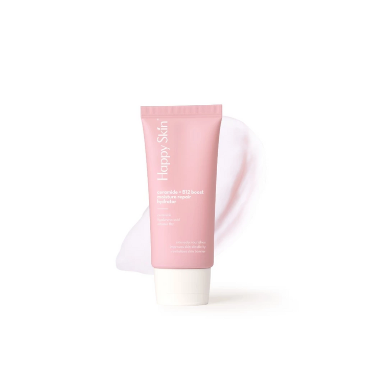 Pink skincare tube labeled 'Happy Skin' on a white background
