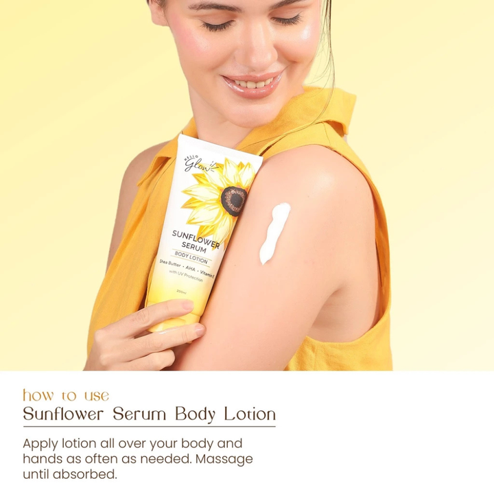 Woman applying sunflower serum body lotion on her arm with a yellow background Hello Glow Sunflower Serum Body Lotion with UV Protection 200ml