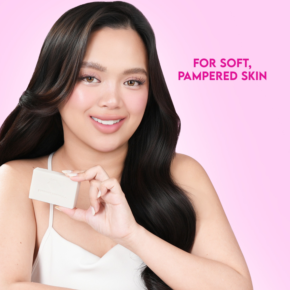 Woman holding a skincare product with text 'For soft, pampered skin' on a pink background Perfect Formula KayakuKayamu Bleaching Soap 10 bars