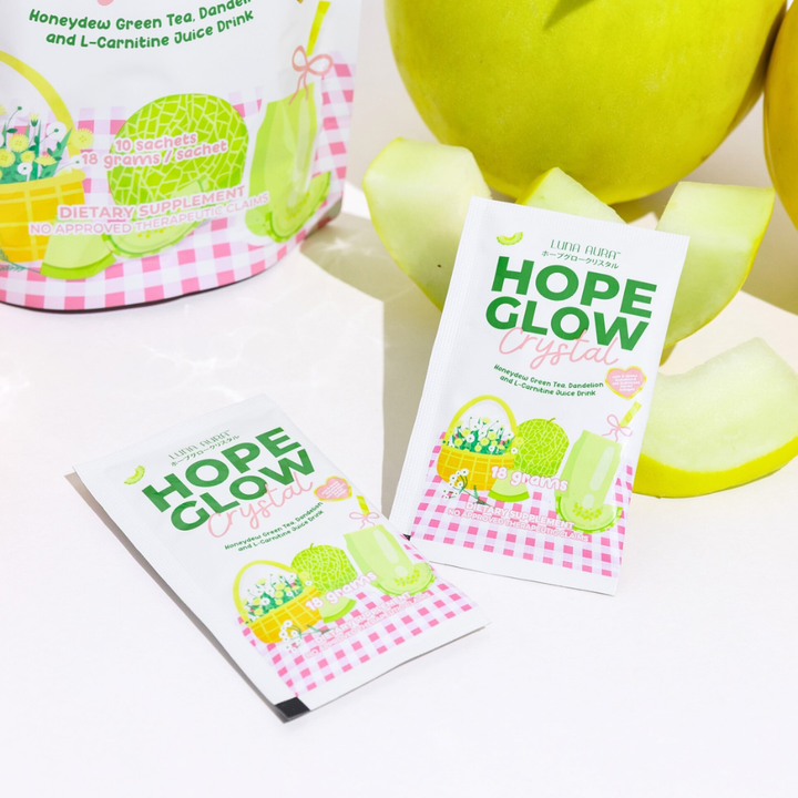Hope Glow dietary supplement packets with green tea and lemon graphics on a white background. Luna Aura Hope Glow Crystal - Honeydew Green Tea, Dandelion and L-Carnitine Juice Drink
