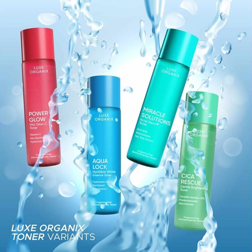 Four Luxe Organix toner bottles with water splashes on a blue background Luxe Organix Aqua Lock HyaGlow Essence Toner 150ml