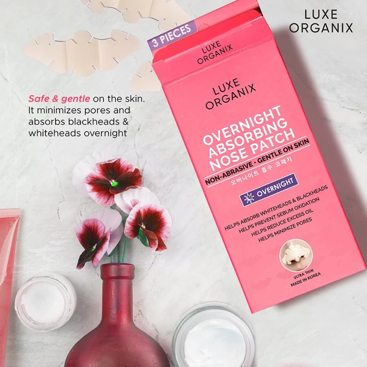 Luxe Organix Overnight Absorbing Nose Patch packaging with flowers and a bottle on a light background