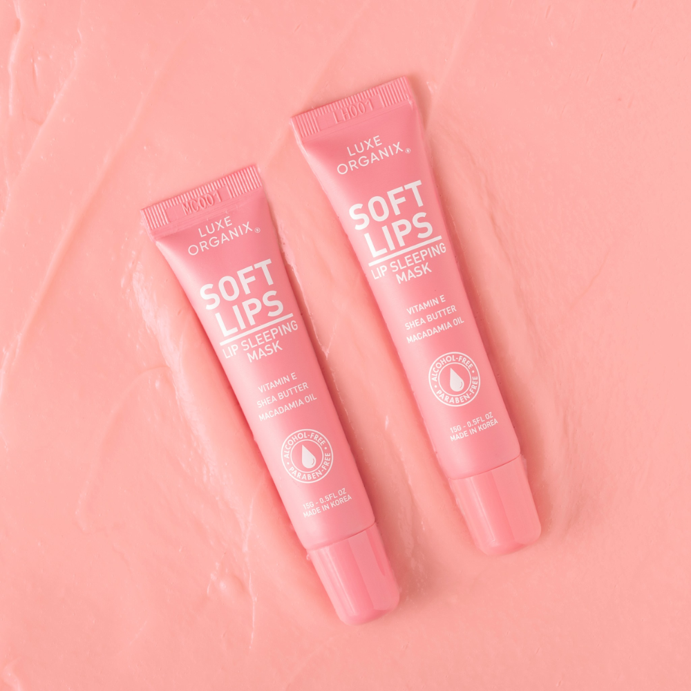 Two pink tubes of Luxe Organix Soft Lips Lip Sleeping Mask on a pink background