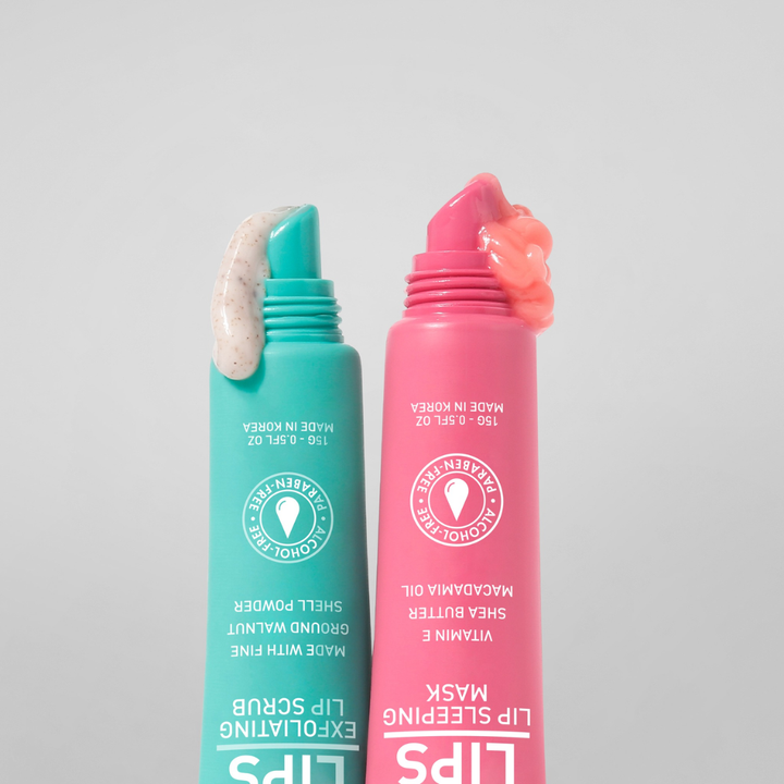Two lip care products, one green and one pink, on a light gray background.