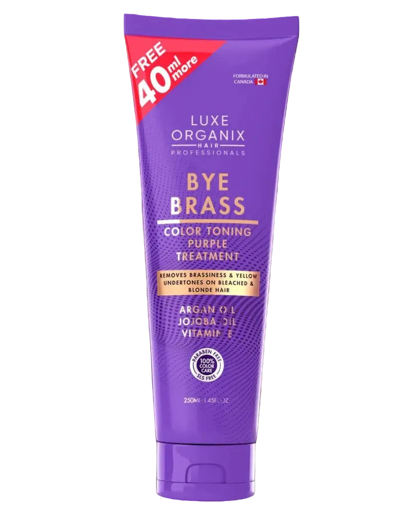 Luxe Organix Bye Brass hair care products on a purple background