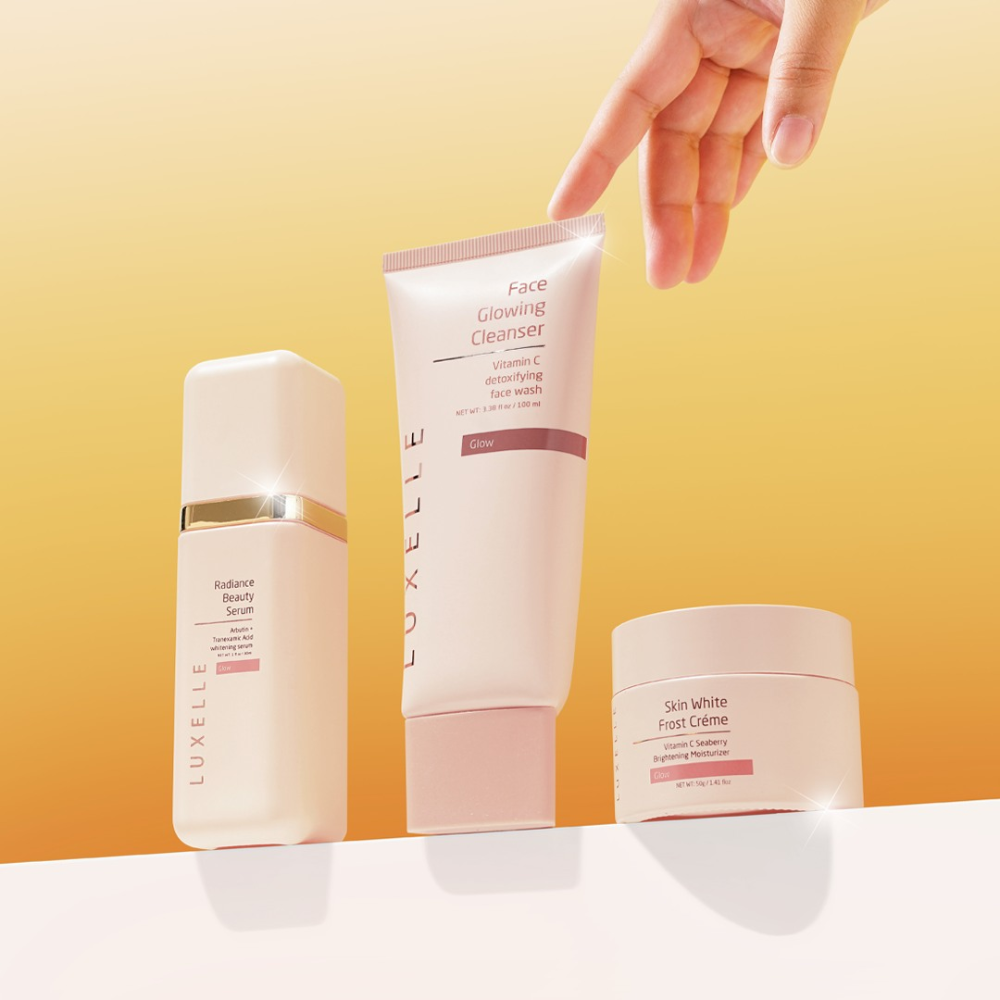 Luxelle skincare products on a gradient yellow background