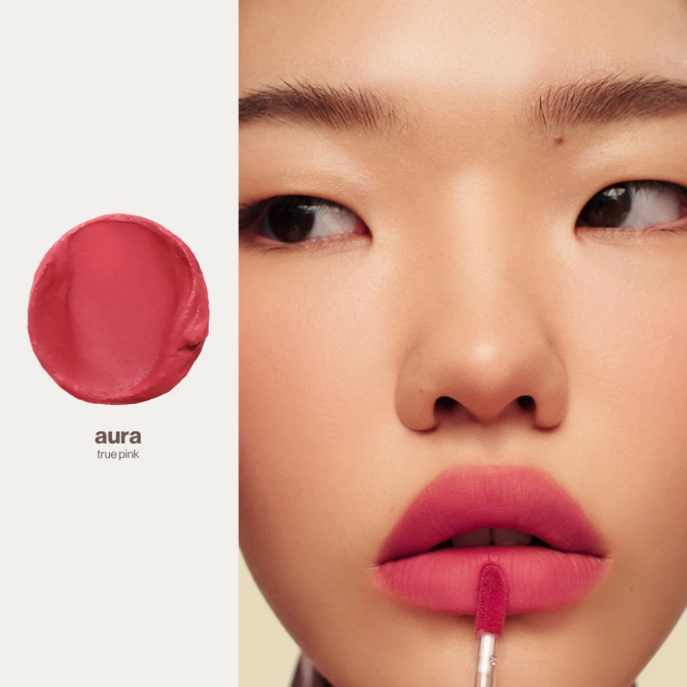 Lipstick with 'aura' color swatch and a model wearing it. Sunnies Face Lip Dip - Aura