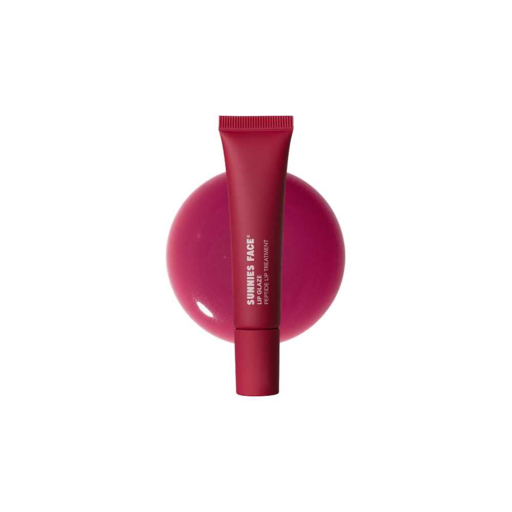 Red tube on a pink sphere with Sunnies Face branding on a white background Sunnies Face Lip Glaze - a peptide lip treatment