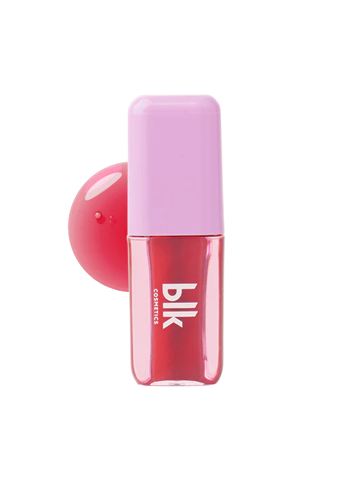 blk cosmetics Color Adapting Lip and Cheek Oil bottle with pink cap and red product drop on white background