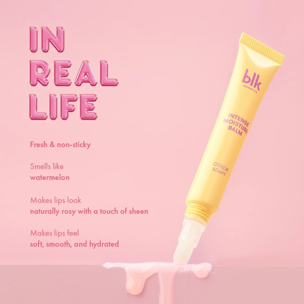 Yellow lip balm tube with text on a pink background Blk Cosmetics Color Adapting Intense Moisture Lip Balm