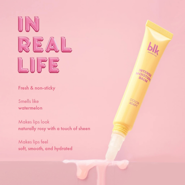 Yellow lip balm tube with text on a pink background Blk Cosmetics Color Adapting Intense Moisture Lip Balm